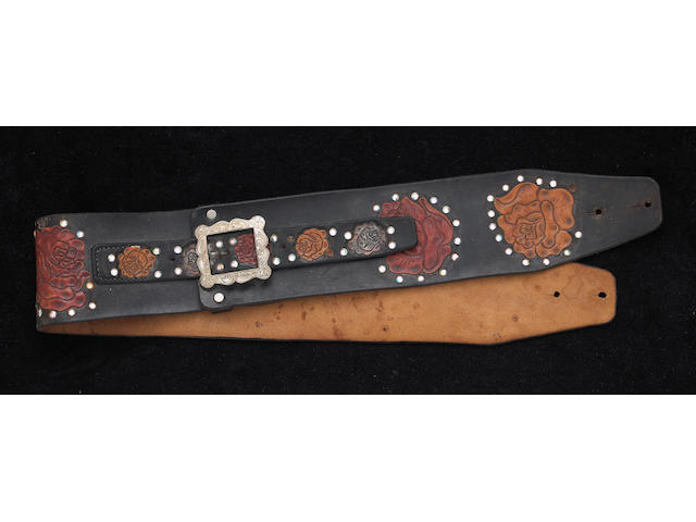A Jerry Garcia tooled leather guitar strap by Nudie's, worn on stage, 1973