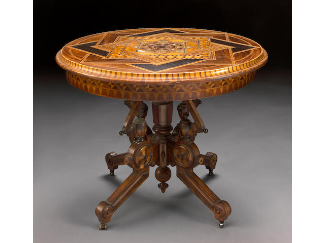 An Italian Aesthetic inlaid walnut center table