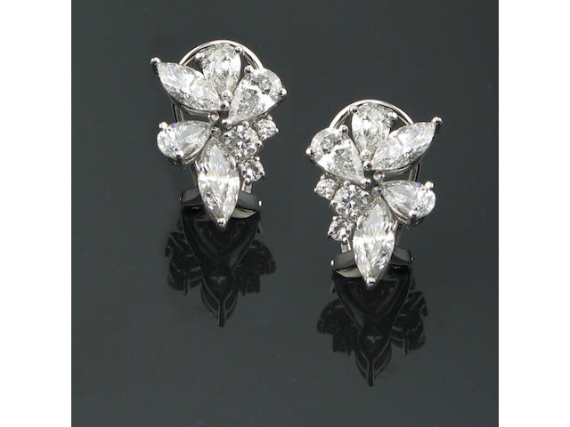 A pair of diamond and 18k white gold earrings,