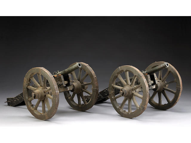 A pair of bronze cannons with associated field carriages