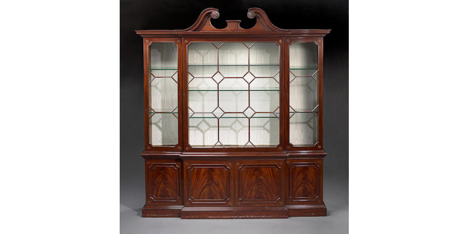 A George III style inlaid mahogany breakfront bookcase