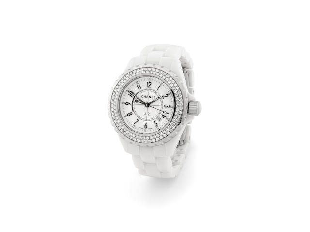 Chanel. A white ceramic, steel and diamond set mid-size quartz calendar bracelet watchJ12, circa 2006