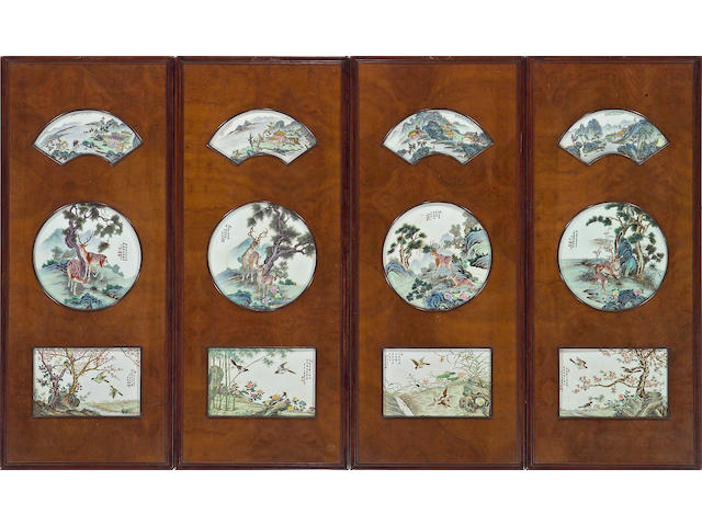 A set of four mixed wood wall panels inset with porcelain plaques 20th Century