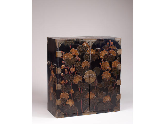 A Japanese lacquer cabinet with peony decoration