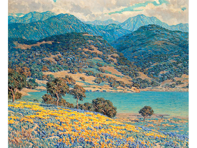 Granville Redmond  (1871-1935) Poppies and lupine by a lake with mountains in the distance 28 3/4 x 35in