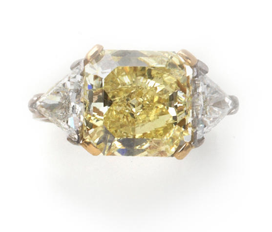 A fancy colored diamond and diamond ring