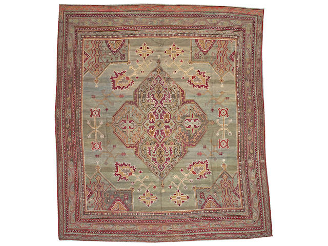 An Oushak carpet West Anatolia, size approximately 11ft. 5in. x 13ft. 2in.