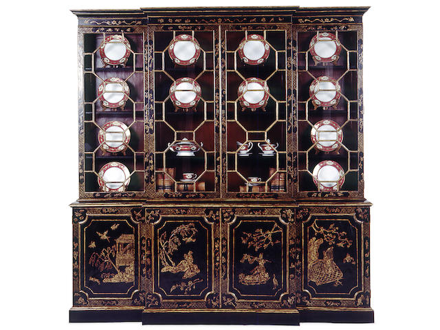 An imposing George III style lacquered breakfront bookcase cabinet