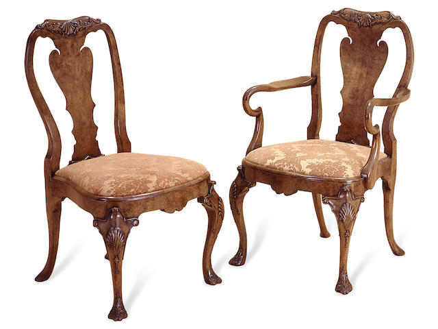 A set of twelve Queen Anne style walnut dining chairs