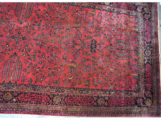 A Persian Kashan carpet size approximately 9ft. x 18ft. 7in.