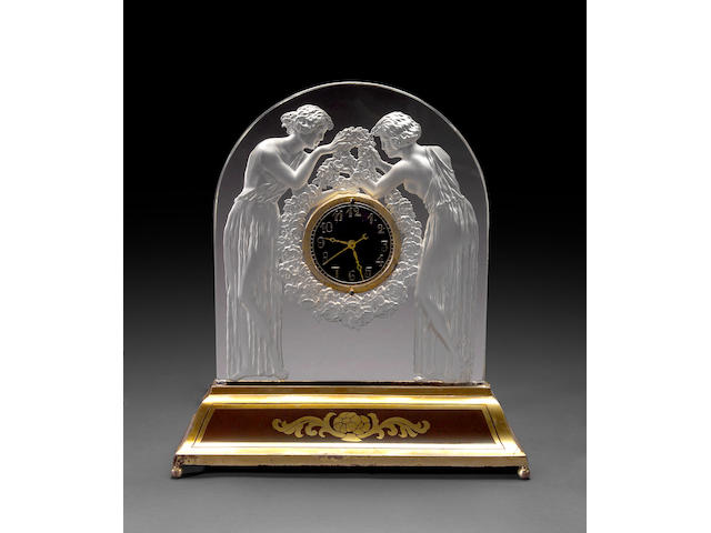 A Ren&#233; Lalique frosted glass table clock: Deux Figurines  Marcilhac 726, model introduced 1926