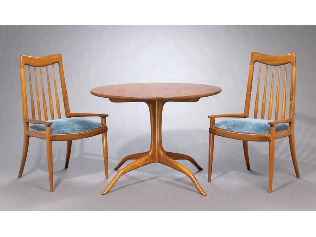A Sam Maloof walnut circular breakfast table and four back chairs