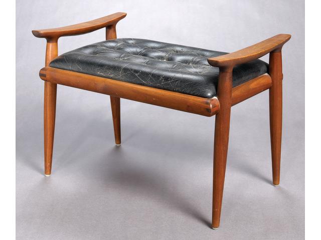 A Sam Maloof walnut and leather bench