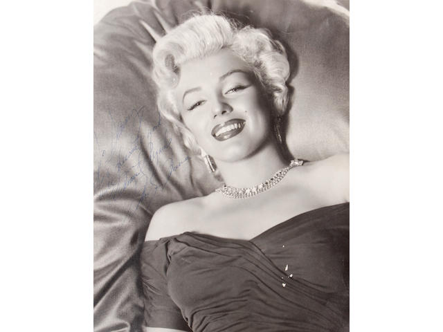 A Marilyn Monroe signed black and white photograph, early 1950s