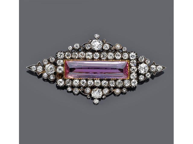 An antique pink topaz and diamond brooch,