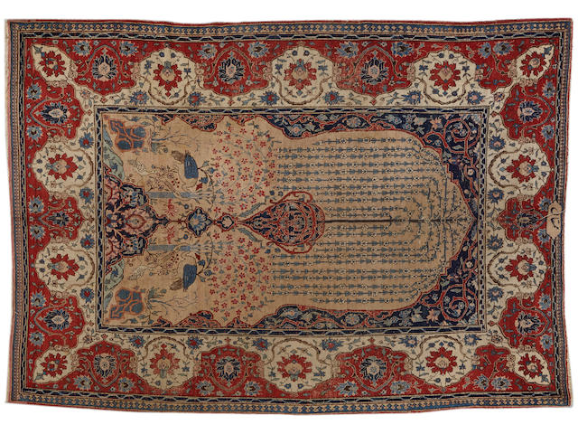 A Tabriz carpet  size approximately 8ft. 1in. x 11ft.