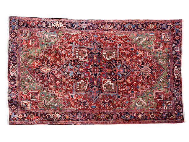 A Heriz carpet size approximately 8ft. 1in. x 3ft. 1in.