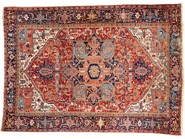 A Heriz carpet  size approximately 9ft. 1in. x 12ft. 9in.