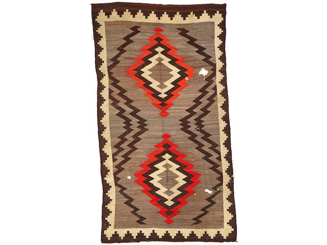 A Navajo rug size approximately 6ft. 2in. x 11ft. 3in.