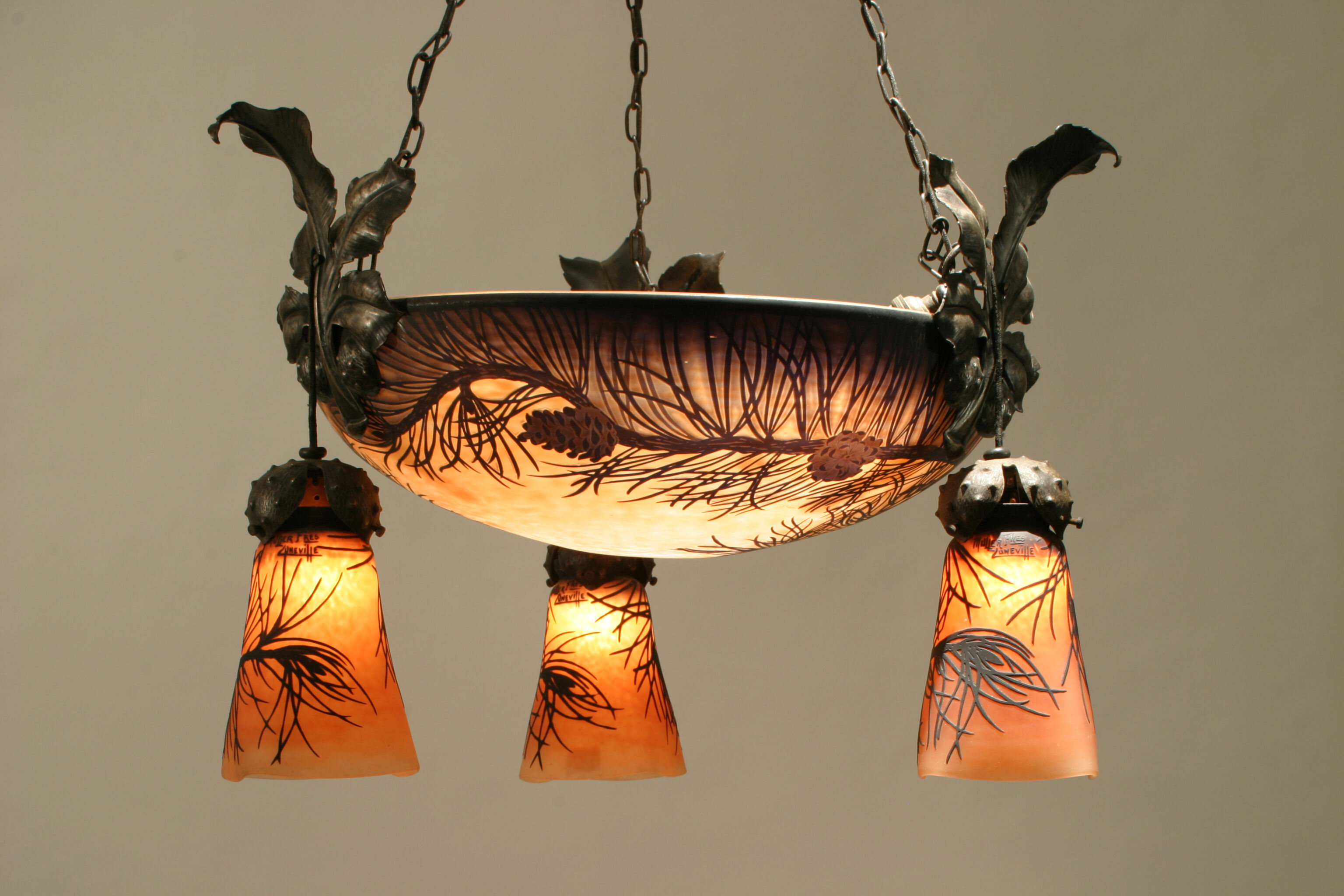 A Müller Frères cameo glass and iron three-arm chandelier