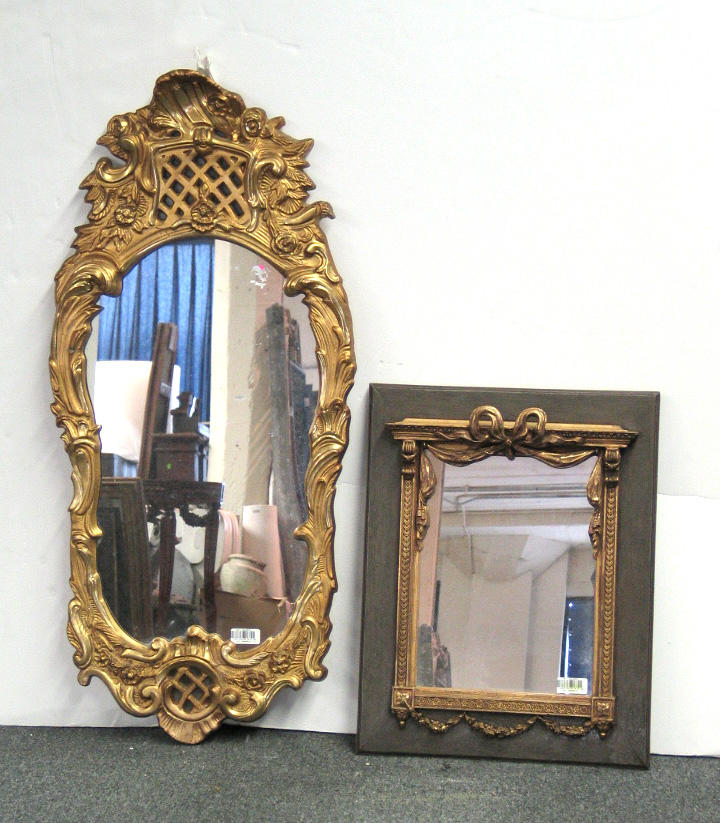A Rococo style gilt composition mirror, together with a Neoclassical style...