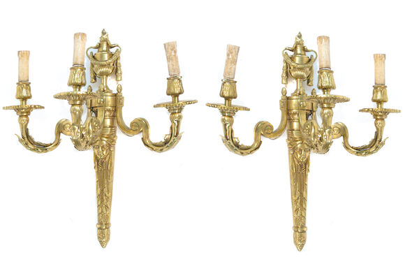 Bonhams : A pair of Louis XVI style three light sconces