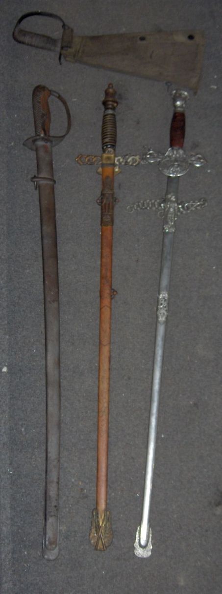 Bonhams Cars : A group of three swords,