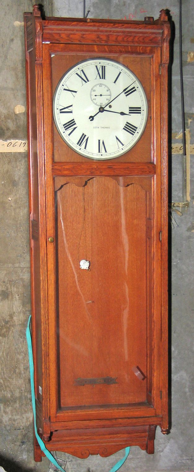 A Seth Thomas oak regulator clock