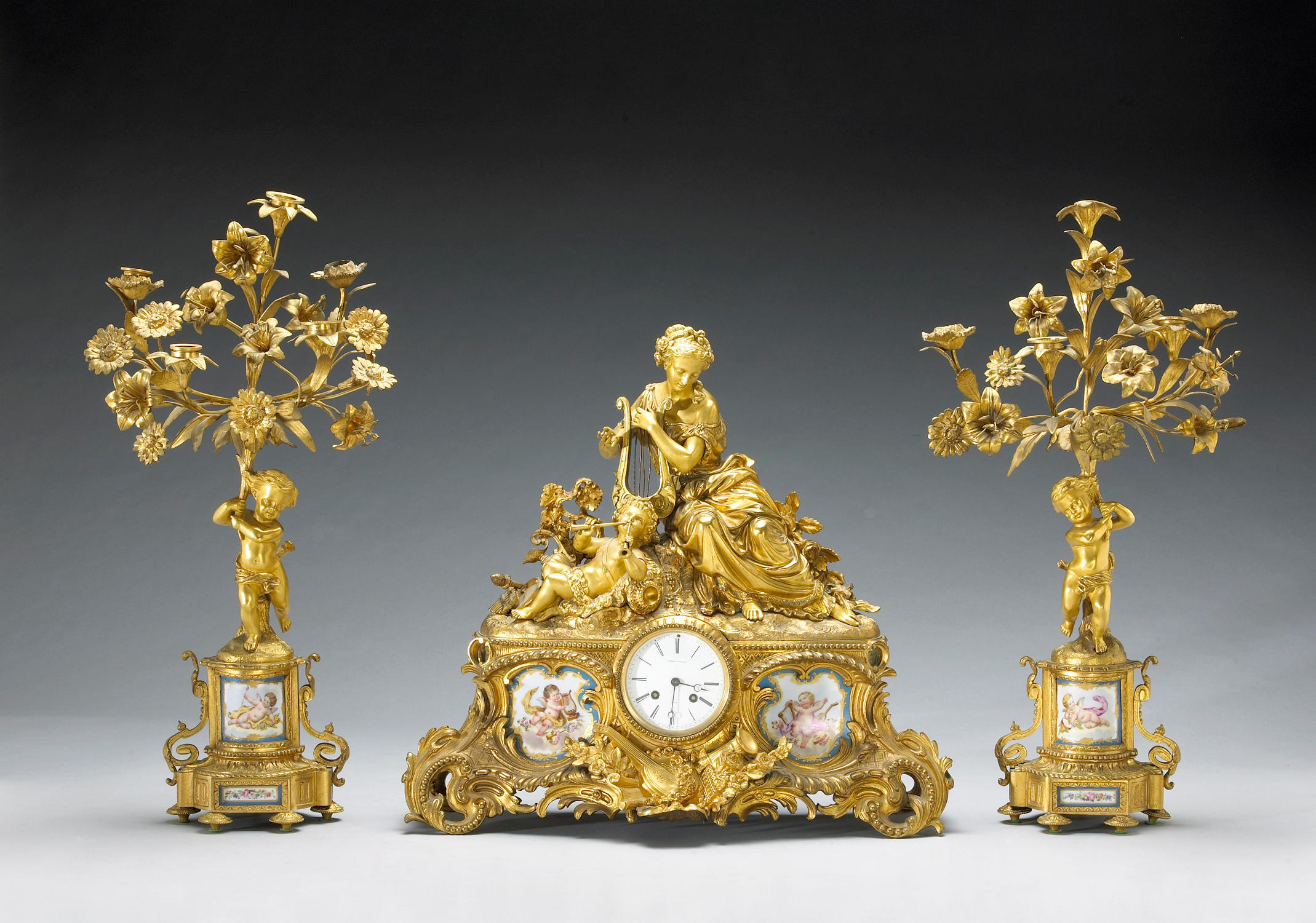 A Napoleon III gilt bronze and porcelain mounted figural assembled clock...