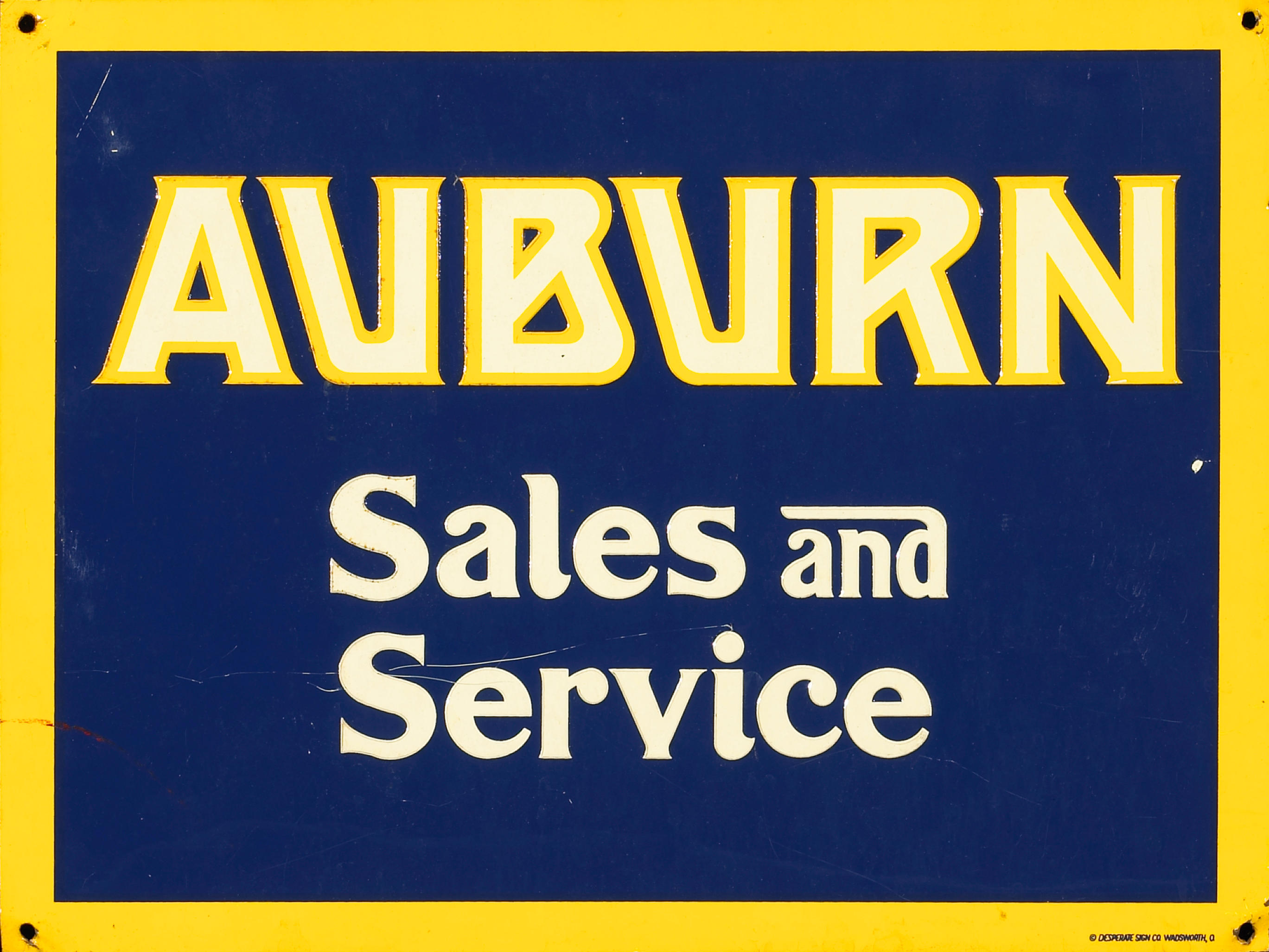 Bonhams Cars : An Auburn Sales and Service embossed sign,