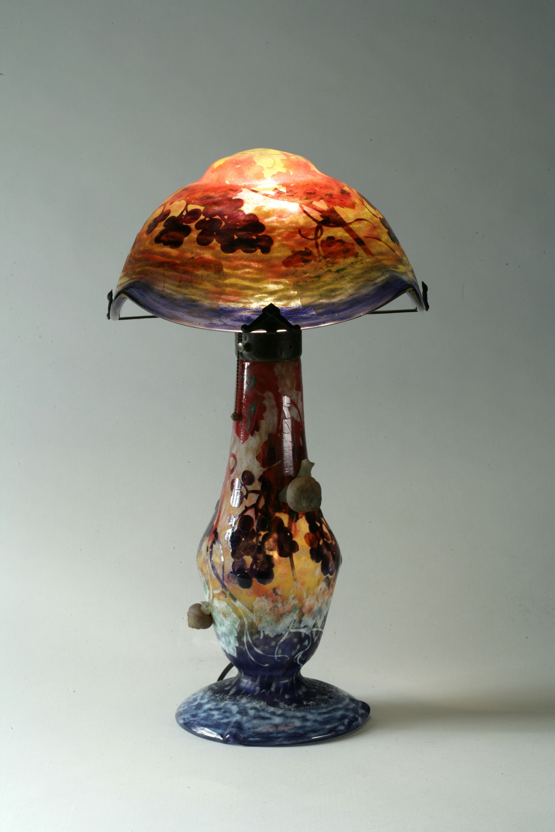 A good Daum Nancy applied cameo glass and wrought-iron snail lam