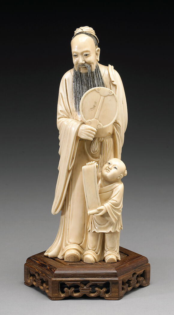 Bonhams : A tinted ivory figural group of a sage and child Late 19th ...