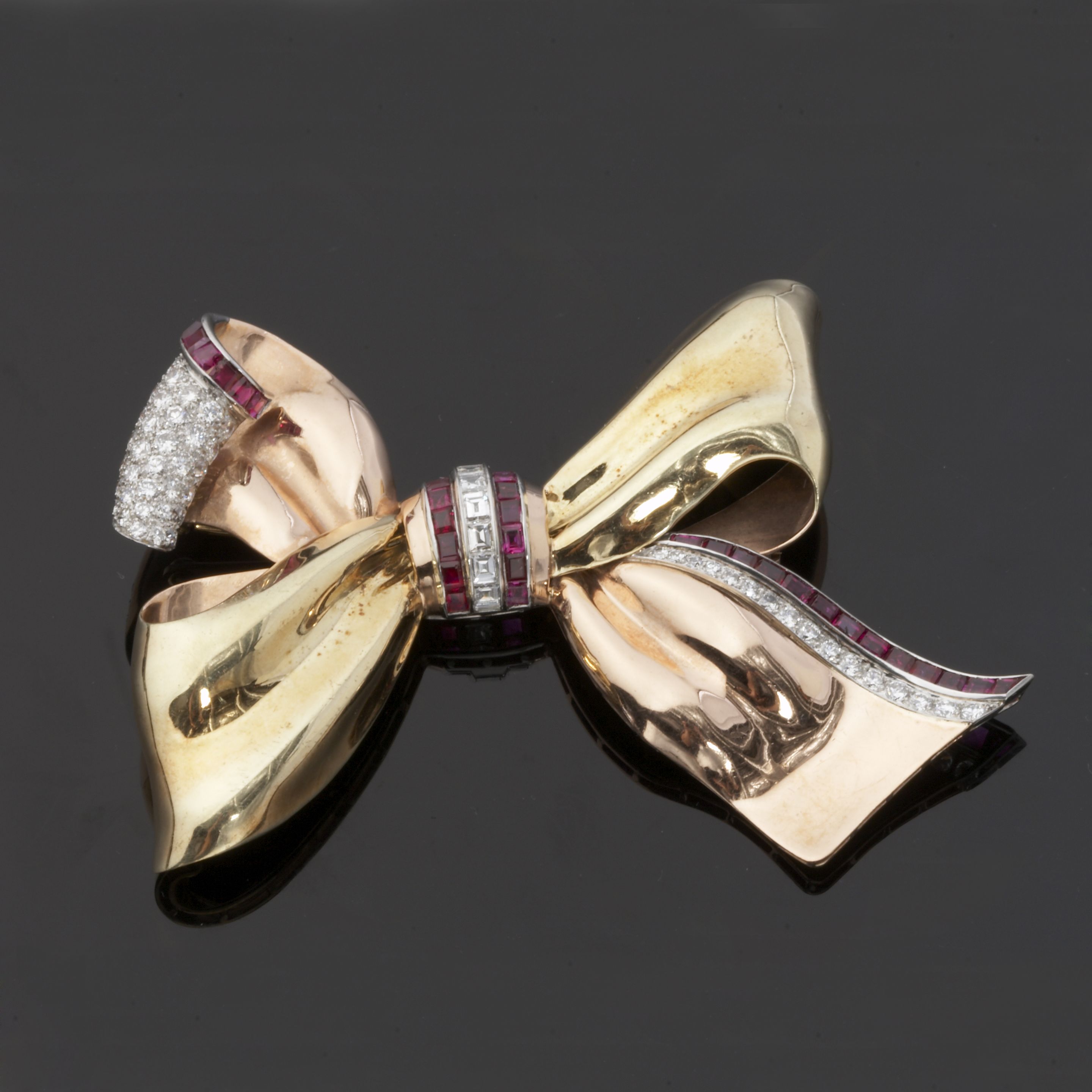 A retro diamond and ruby brooch,