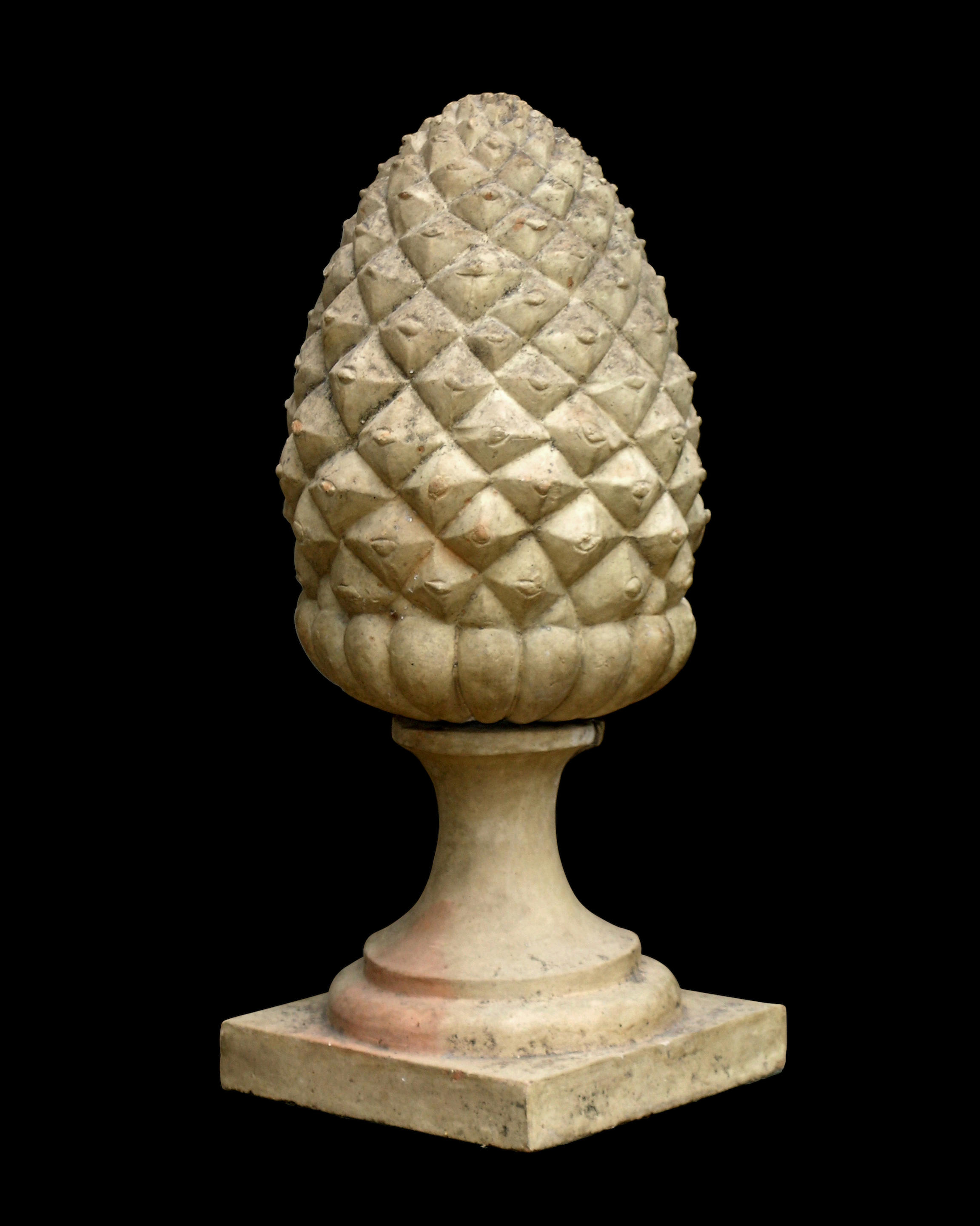 An Italian Neoclassical terracotta pineapple finial