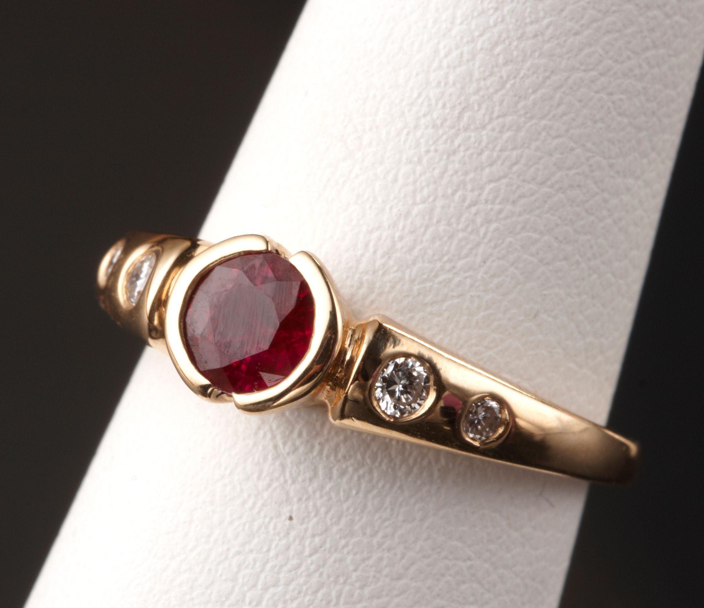 A ruby, diamond and 14k gold ring