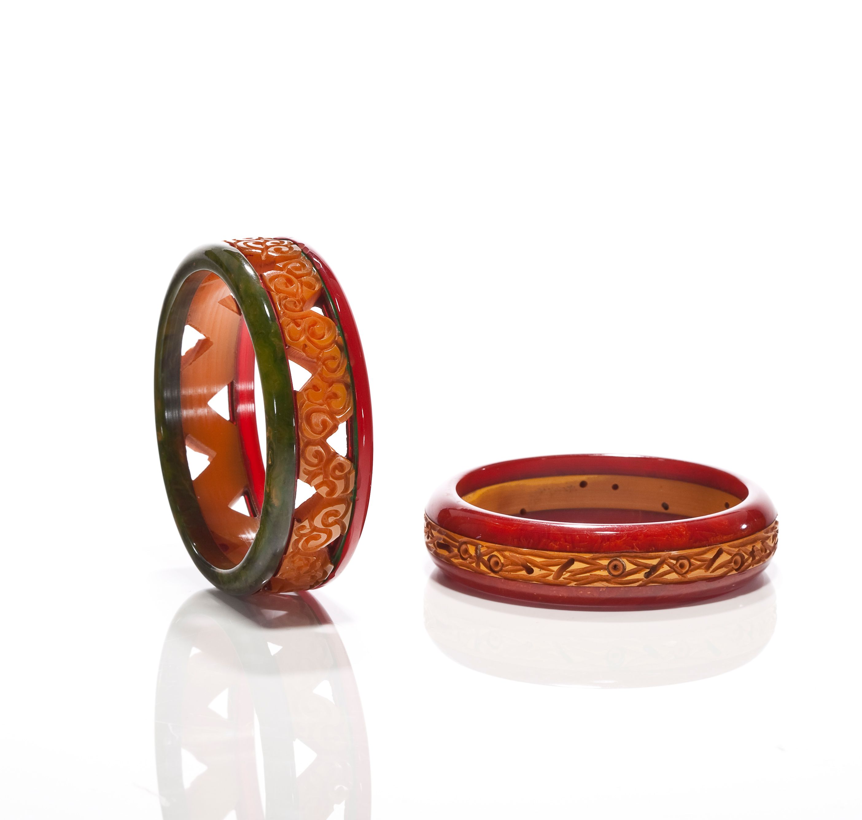 Two multi-colored Bakelite carved laminated bangle bracelets