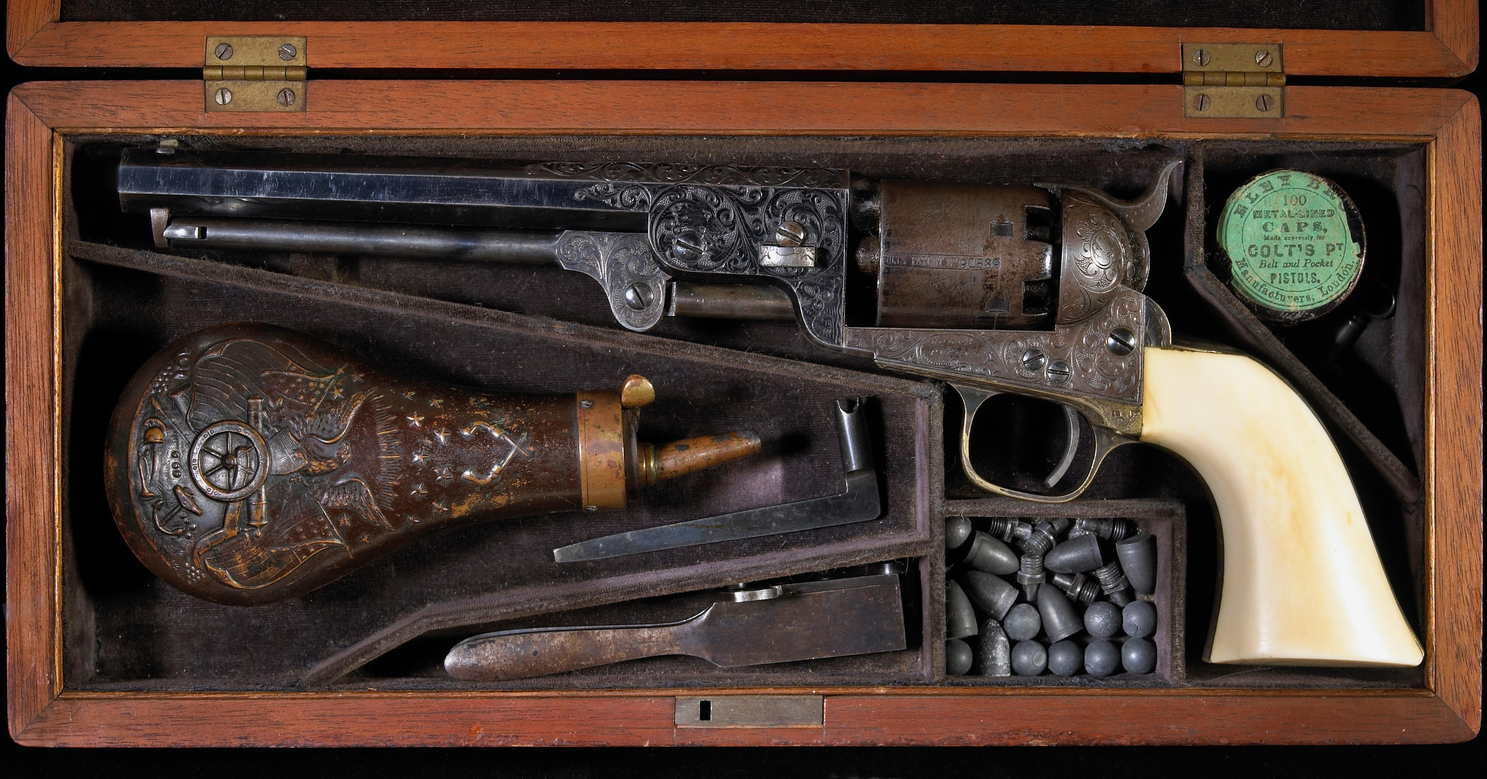A fine cased Gustave Young engraved Colt Model 1851 Navy percussion revolver