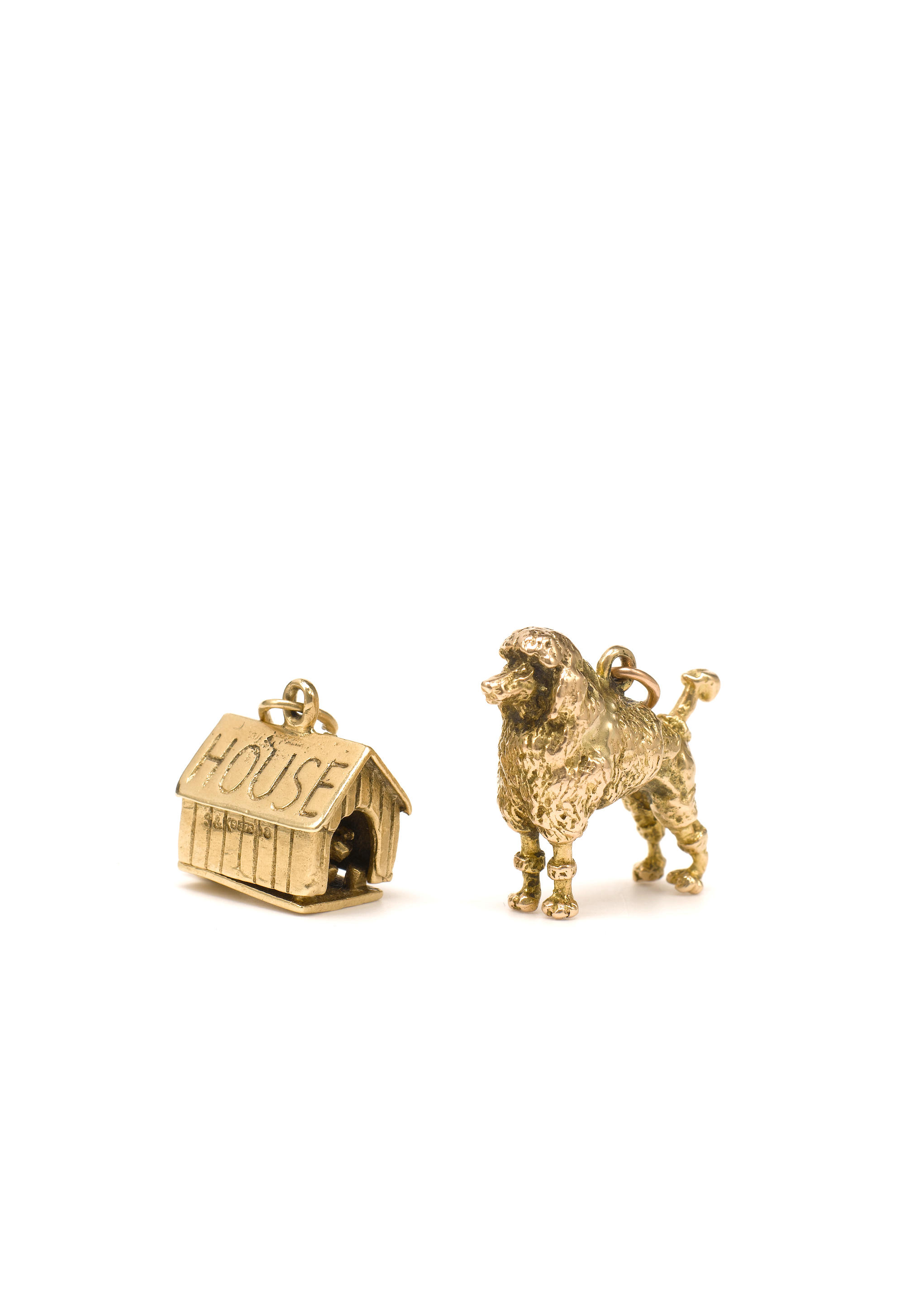 Two gold dog charms
