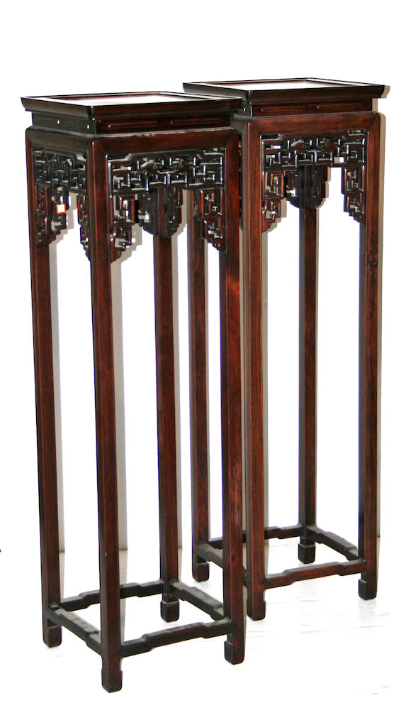 Bonhams : Two hardwood tall display stands with burlwood top