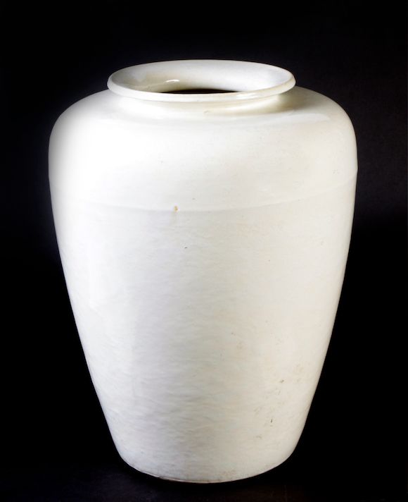 Bonhams A pair of creamglazed stoneware large vases (drilled)