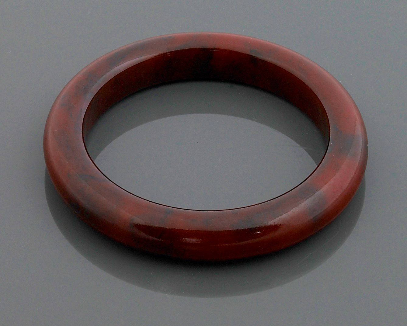 A bakelite brown-ish red bangle