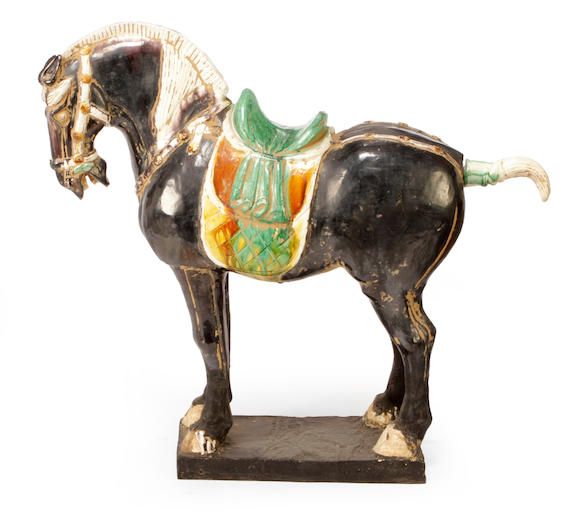 Bonhams : A Tang Dynasty glazed earthenware horse