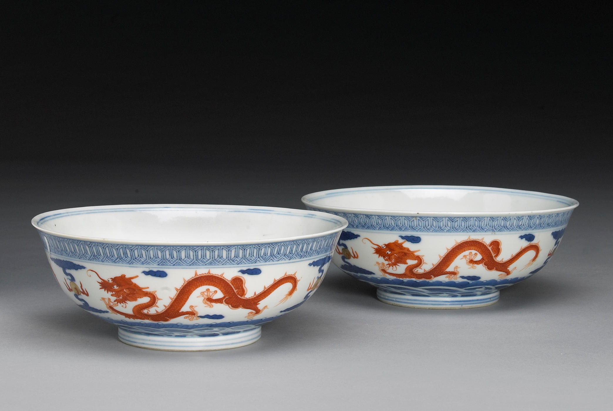 A pair of underglaze blue and iron red enameled porcelain deep bowls