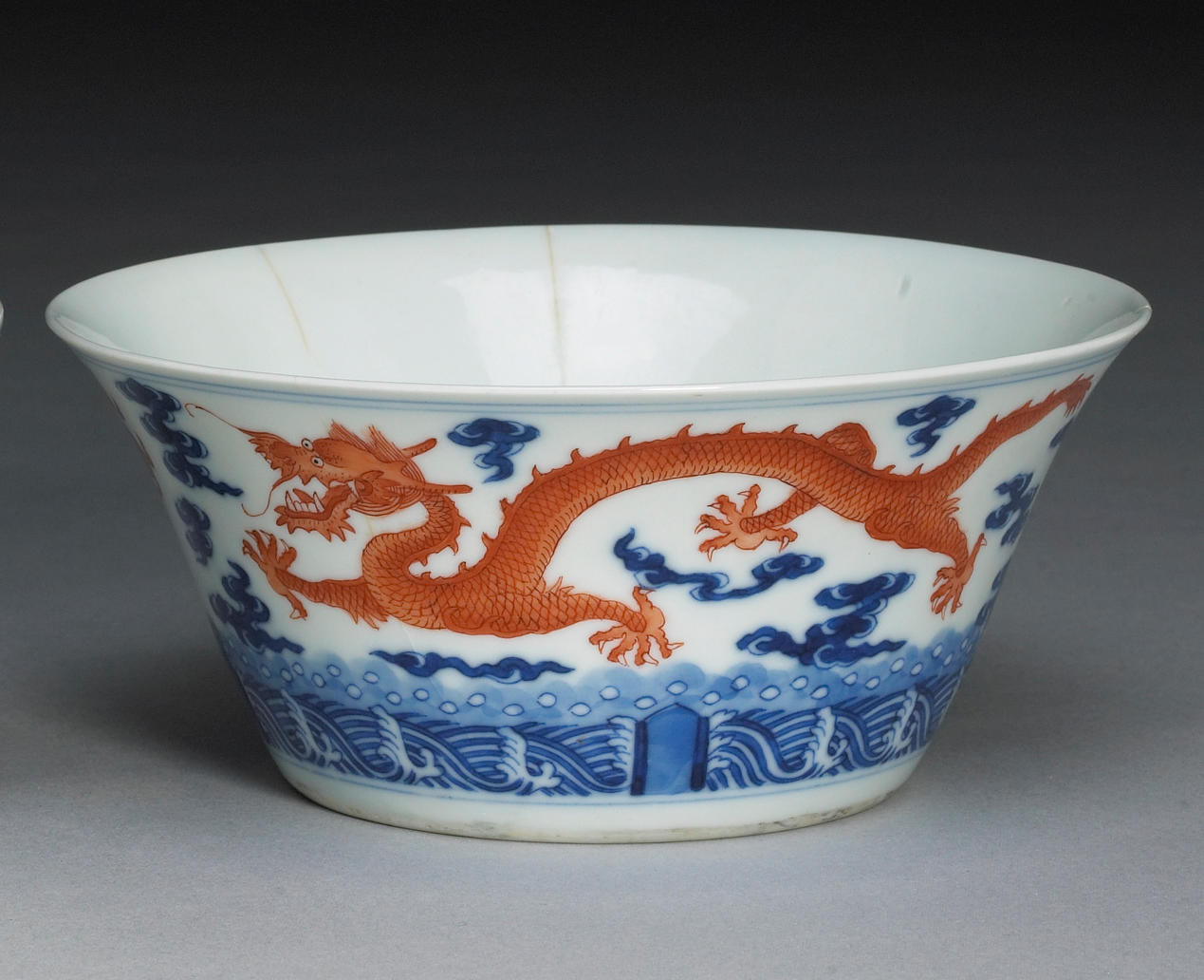 An underglaze blue and iron red enameled dragon bowl