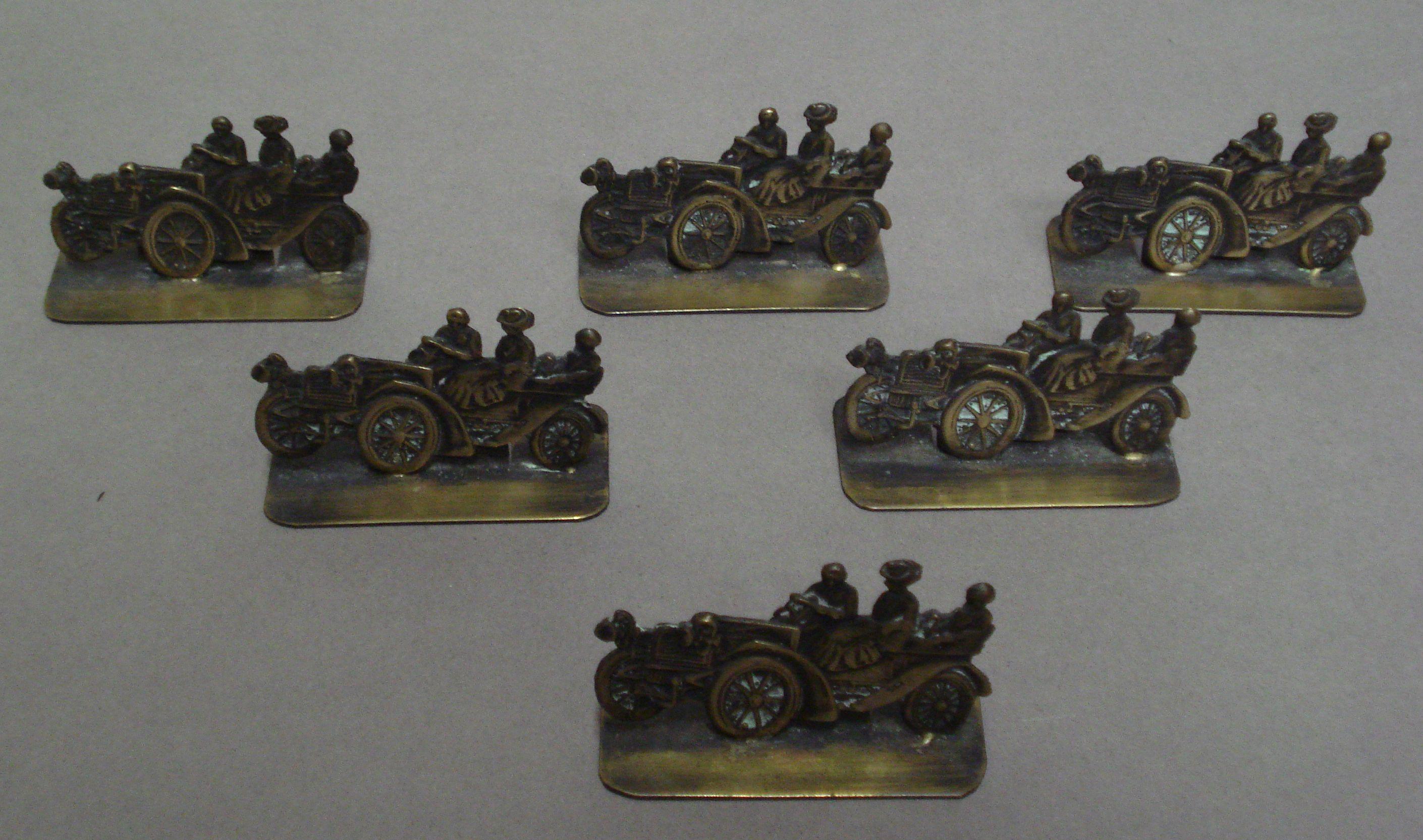 Bonhams Cars : A set of six place setting card holders,