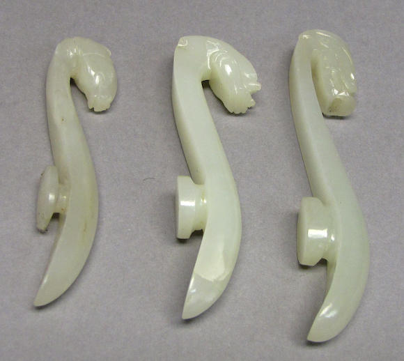 Bonhams : Three white jade belt hooks