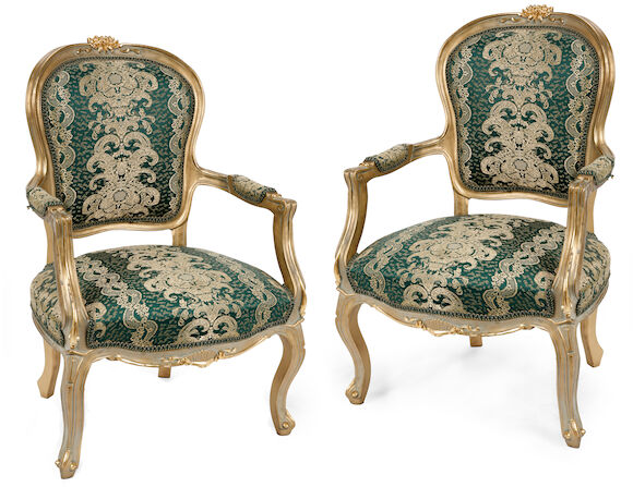 Bonhams : A pair of Louis XV style parcel gilt and upholstered fauteuils