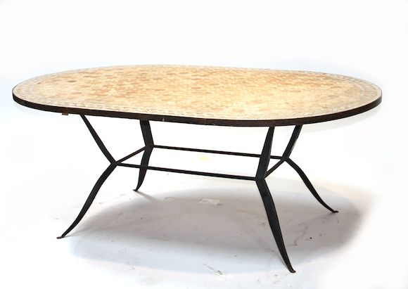 Bonhams : A variegated tile inset oval table on an iron base 20th century