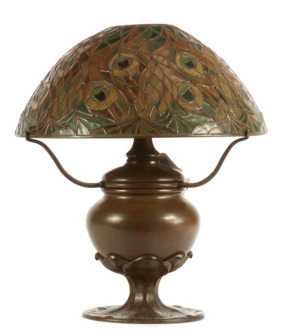 Bonhams A patinated bronze and leaded glass Peacock table lamp