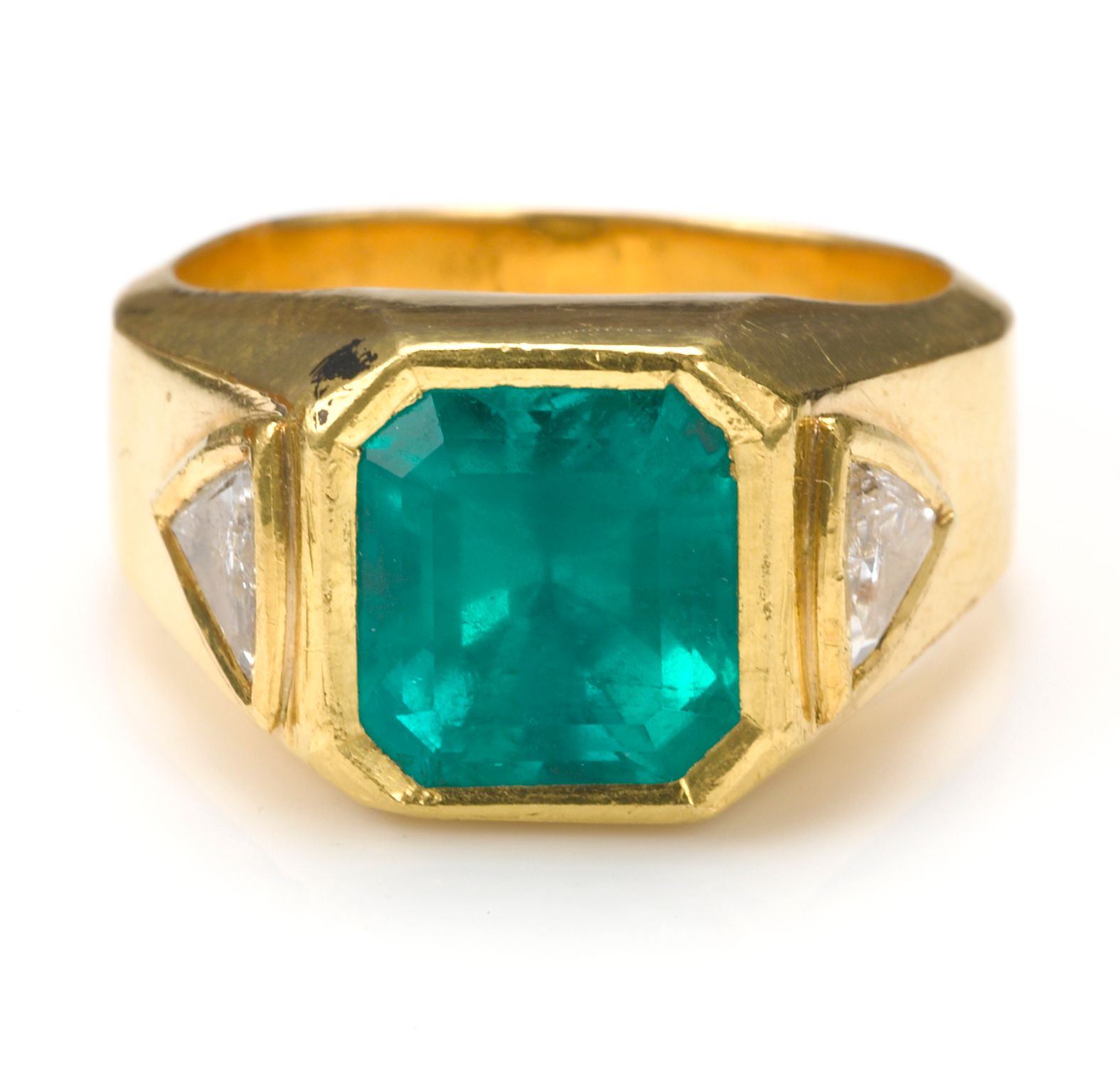 An emerald and diamond ring